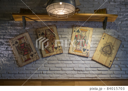 Cafe design. Playing cards on the wall in a coffee shop. Vintage style. High quality photo 84015703