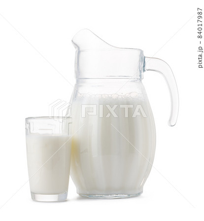 Glass jar and cup of fresh milk isolated 84017987