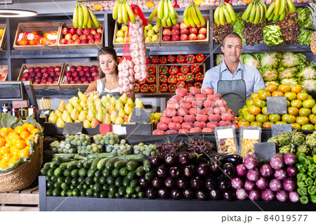 Shop assistants working in fruit and vegetable shop Shop assistants working in fruit and vegetable shop 84019577