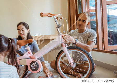 dad took off the wrapper of the new mini bike dad took off the wrapper of the new mini bike 84020945