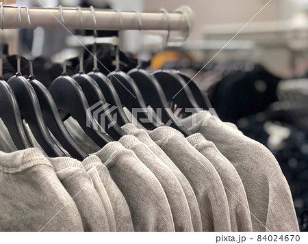 hanged t-shirts in a store 84024670