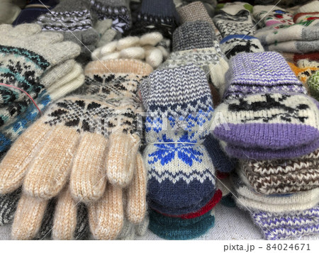 woven gloves and socks at a market woven gloves and socks at a market 84024671