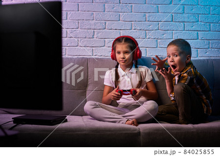 children playing video game with game console 84025855