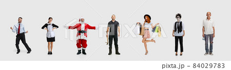 Collage of different people standing in a line isolated on white background. Differentiation 84029783