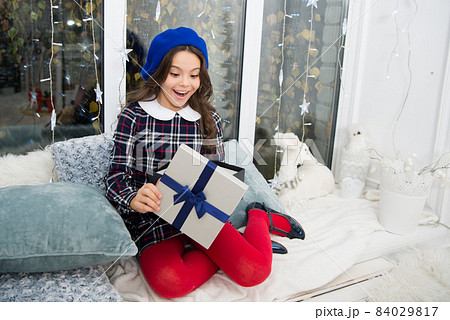 Happiness and joy. Kid at home relaxing on cozy window  84029817