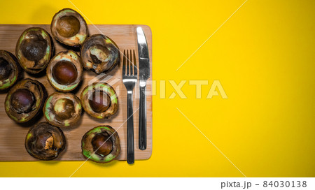 Overripe Fruits Concept on Yellow background. Bad Vegan food. Rotten Avocado on wood Chipper. Copy space Necomestibile Food. Stop wasting food. Bad Avocado Halfs cannot be eaten. Overripe Fruits Concept on Yellow background. Bad Vegan food. Rotten Avocado on wood Chipper. Copy space Necomestibile Food. Stop wasting food. Bad Avocado Halfs cannot be eaten. 84030138