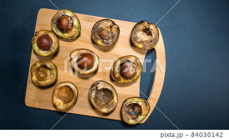 .Overripe Avocado on wood Chipper dark background. Rotten Avocado Fruits in the kitchen on table. Unhelthy food concept. Stop wasting food. Copy space. .Overripe Avocado on wood Chipper dark background. Rotten Avocado Fruits in the kitchen on table. Unhelthy food concept. Stop wasting food. Copy space. 84030142