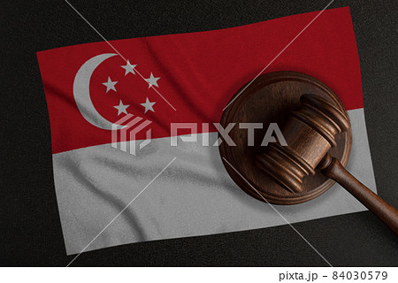 Judges hammer and the flag of Singapore. Law and Justice. Constitutional law Judges hammer and the flag of Singapore. Law and Justice. Constitutional law 84030579