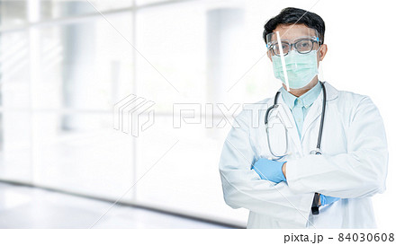 Asian doctor wearing face shield and PPE suit new normal to check patient protect safety infection Covid-19 Coronavirus outbreak at quarantine nursing hospital; for header banner Asian doctor wearing face shield and PPE suit new normal to check patient protect safety infection Covid-19 Coronavirus outbreak at quarantine nursing hospital; for header banner 84030608