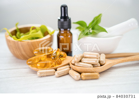 Alternative medicine herbal organic capsule with vitamin E omega 3 fish oil, mineral, drug with herbs leaf natural supplements for healthy good life. Alternative medicine herbal organic capsule with vitamin E omega 3 fish oil, mineral, drug with herbs leaf natural supplements for healthy good life. 84030731