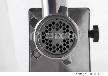 Metal meat grinder isolated on white background 84031506