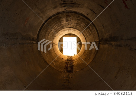 Dark Tunnel with light at the end Dark Tunnel with light at the end 84032113