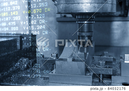 The abstract scene CNC milling machine cutting the stamping die parts and G-code data background. 84032176