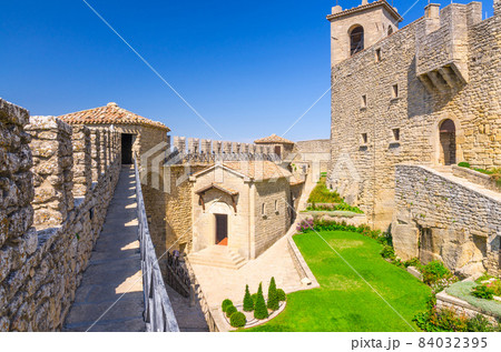 Courtyard with green grass lawn of Prima Torre Guaita first medieval tower 84032395