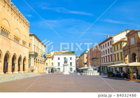Old colorful multicolored building and houses and Pope Paul V monument on Piazza Cavour square Old colorful multicolored building and houses and Pope Paul V monument on Piazza Cavour square 84032486