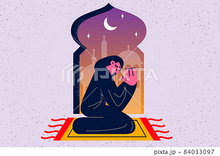 Religious muslim woman pray near mosque  84033097