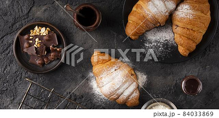 flat lay sweet croissants arrangement. High quality beautiful photo concept flat lay sweet croissants arrangement. High quality beautiful photo concept 84033869