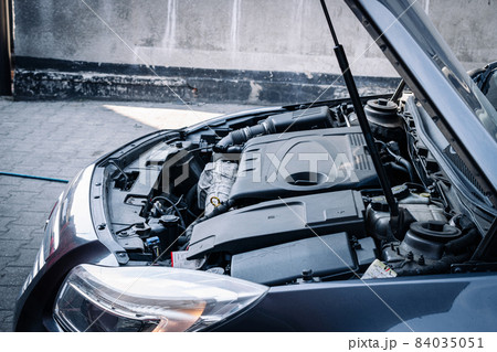 Car service auto. Automotive repair in garage workshop. Mechanic engine vehicle diagnostic. Technician maintenance. 84035051