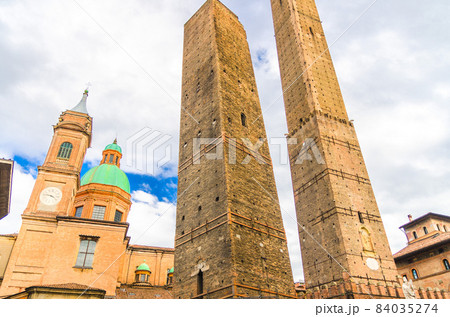 Two medieval towers of Bologna Le Due Torri: Asinelli and Garisenda and Chiesa di San Bartolomeo Gaetano church 84035274