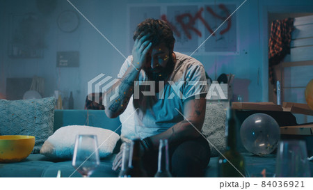 Man waking up during party Man waking up during party 84036921