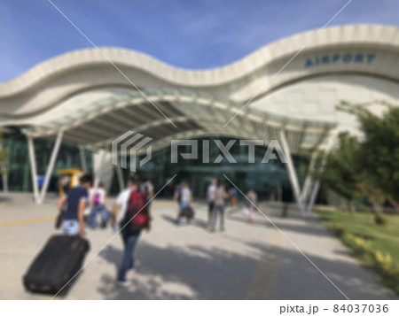 Blurred background with people entering into a airport 84037036