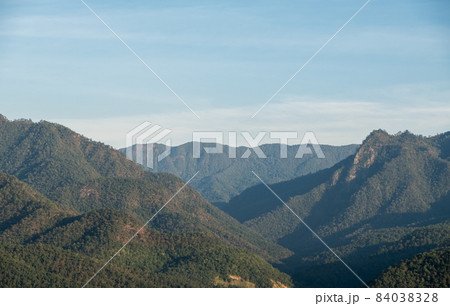 Tranquil view of the tropical forest on high mountain range from the viewpoint in the national park. Tranquil view of the tropical forest on high mountain range from the viewpoint in the national park. 84038328