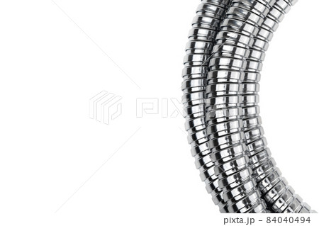 Shower hose on a white background. Silver shower hose close-up. 84040494
