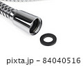 Shower hose on a white background. Silver shower hose close-up. 84040516