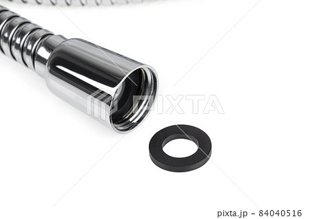 Shower hose on a white background. Silver shower hose close-up. 84040516
