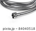 Shower hose on a white background. Silver shower hose close-up. 84040518