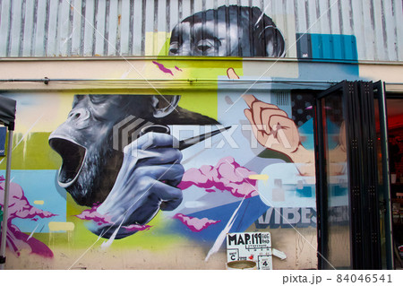 London urban street art with chimpanzee on industrial warehouse 84046541
