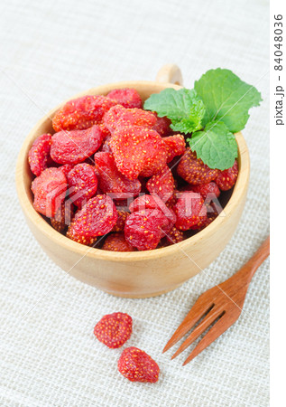 Dried Strawberries in wooden bowl. Dried Strawberries in wooden bowl. 84048036