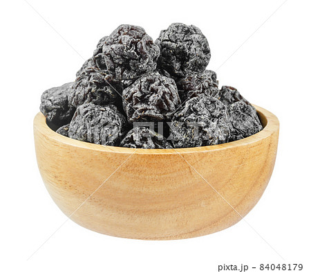 Salted Black plum in wooden bowl isolated on white background. 84048179