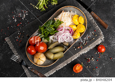 Assorted vegetable pickles on a plate. Assorted vegetable pickles on a plate. 84048204