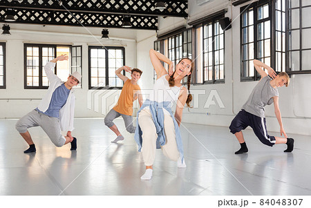 Group of young artists performing street dance Group of young artists performing street dance 84048307