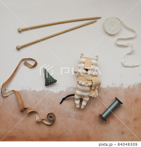 Christmas flat lay with a tiger toy, symbol of new 2022, a gift and decorations. Christmas, winter, new year concept Christmas flat lay with a tiger toy, symbol of new 2022, a gift and decorations. Christmas, winter, new year concept 84048309