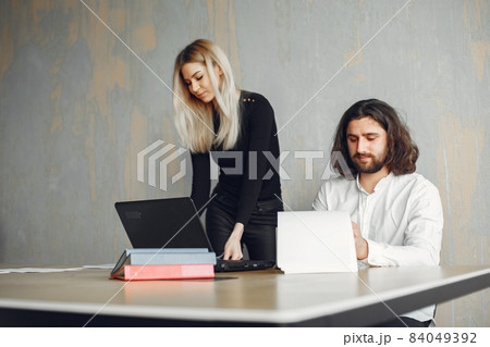 Stylish businessman with woman working at the office 84049392