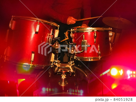 A drummer is on the stage. A man is playing music. . A music event A drummer is on the stage. A man is playing music. . A music event 84051928