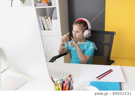 Girl having online school classes from home because of pandemic situation 84052231