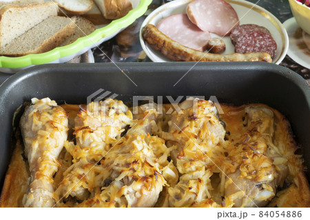 Chicken meat in milt with egg and spice on pan. 84054886