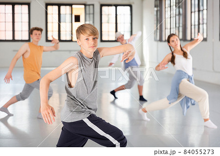 Group teenagers dancing hip-hop indoors Group teenagers dancing hip-hop indoors 84055273