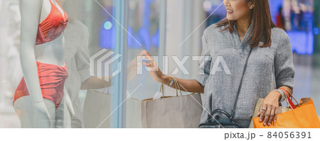 Banner of Asian woman walking and looking for underwear on model display mockup in store shop at department center, lifestyle fashion and leisure, sales and black friday concept Banner of Asian woman walking and looking for underwear on model display mockup in store shop at department center, lifestyle fashion and leisure, sales and black friday concept 84056391