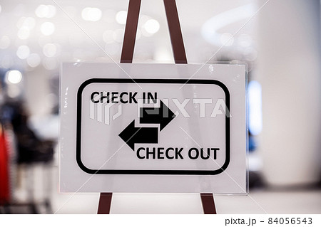 Check in and Check out text on the Billboard before walking in department store 84056543