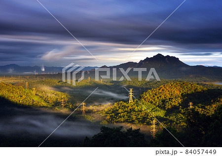Sea of fog and coal-fired power plant. 84057449