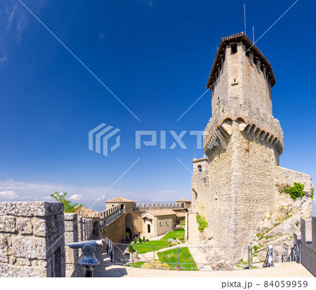 Prima Torre Guaita first medieval tower with stone brick fortress wall with merlons on Mount Titano rock Prima Torre Guaita first medieval tower with stone brick fortress wall with merlons on Mount Titano rock 84059959