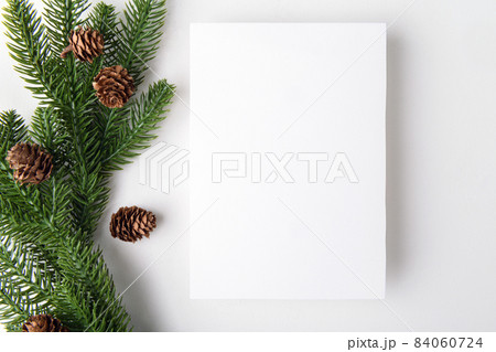 christmas 5x7 empty card mockup with Christmas tree twigs on a white background 84060724