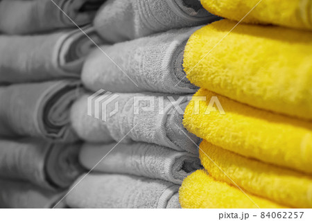 Stack of bath towels close-up. Spa accessories for health care. Trend colors of the year 2021 Stack of bath towels close-up. Spa accessories for health care. Trend colors of the year 2021 84062257