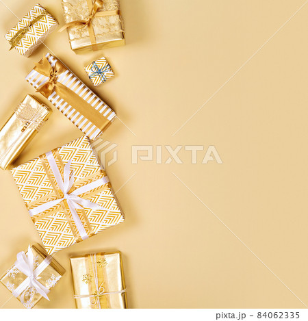 Many different luxury stylish gift boxes in golden tones. Many different luxury stylish gift boxes in golden tones. 84062335