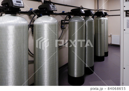 several water softener filters for water stand in a row.water treatment system.ecology several water softener filters for water stand in a row.water treatment system.ecology 84068655