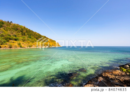 Rocky seashore under clear blue sky with clouds in the morning Summer sunny day background Beautiful Sea in Phuket Thailand 84074635